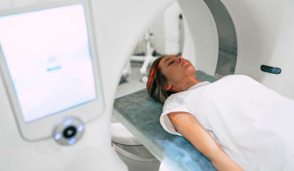 Woman in an MRI with dental fillings