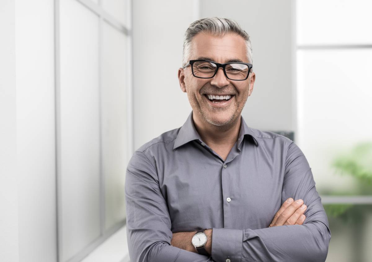 man smiling with dental implants feel natural